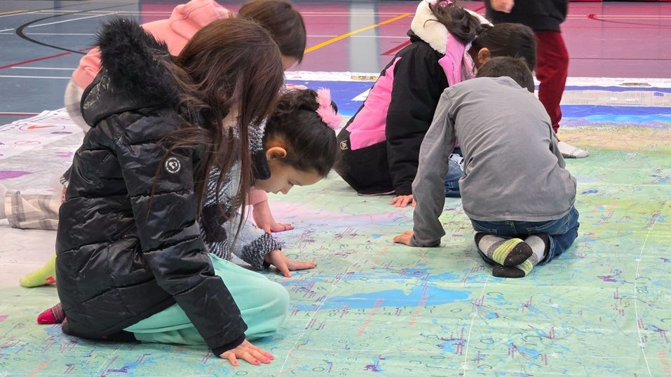 Lake St. Martin learners engage in floor map activity through applying their cultural language.